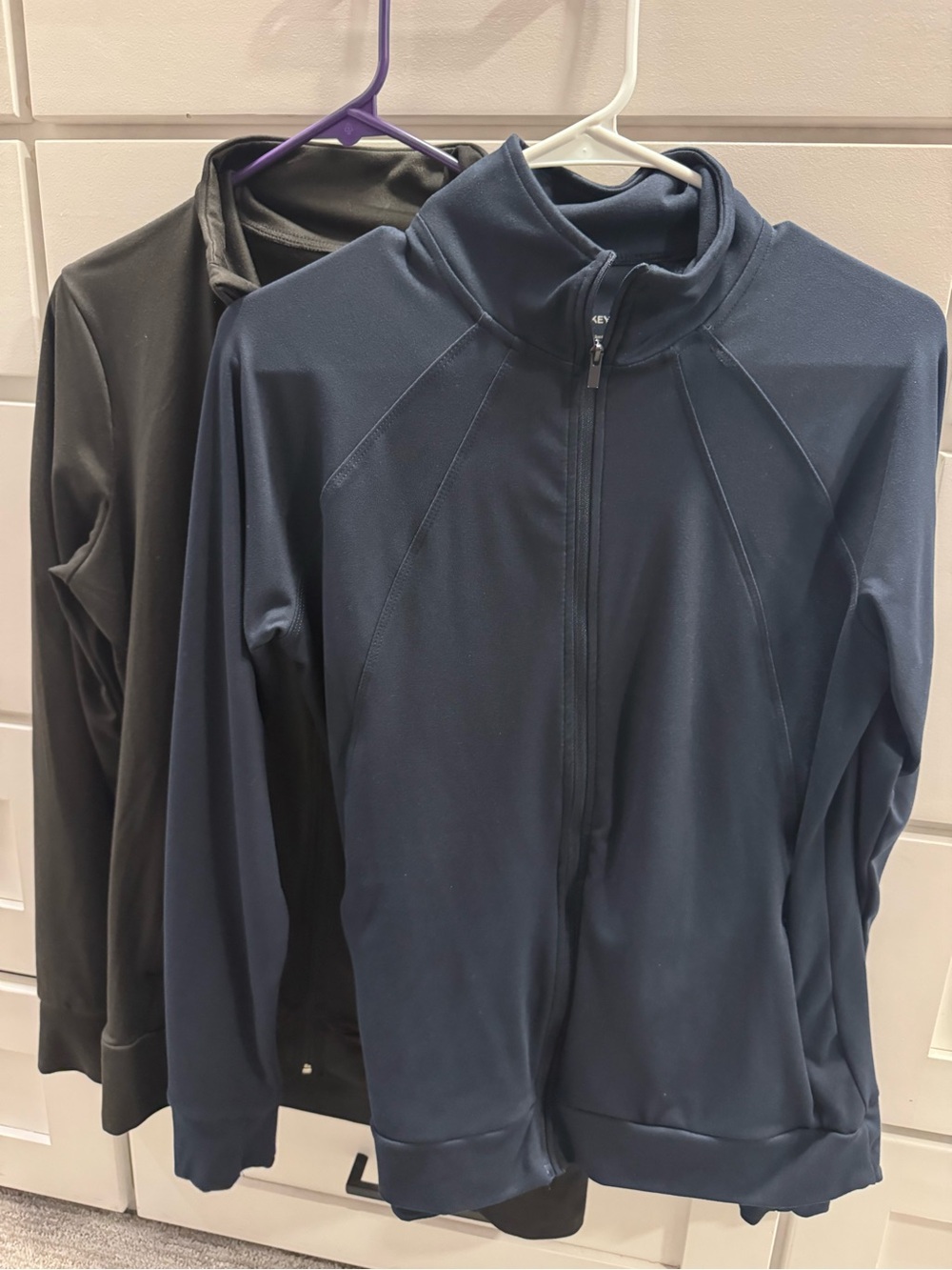 Set of 2- Jockey women’s yoga jackets navy and black